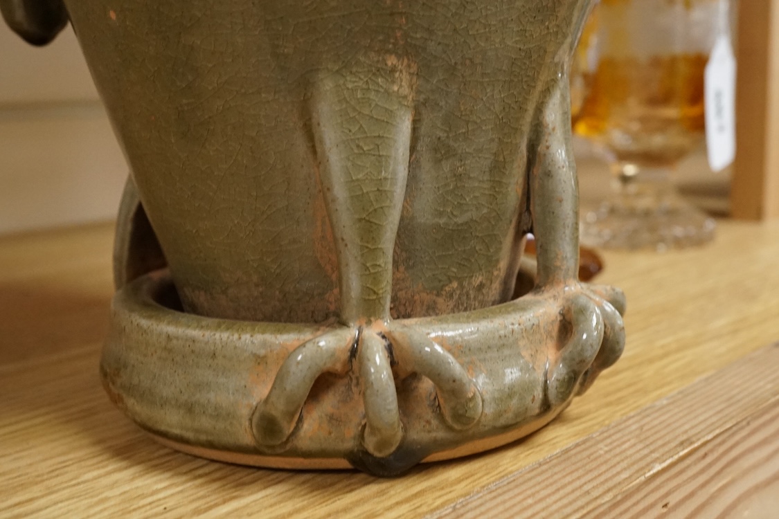 A Korean green glazed bird jar, 33cm high